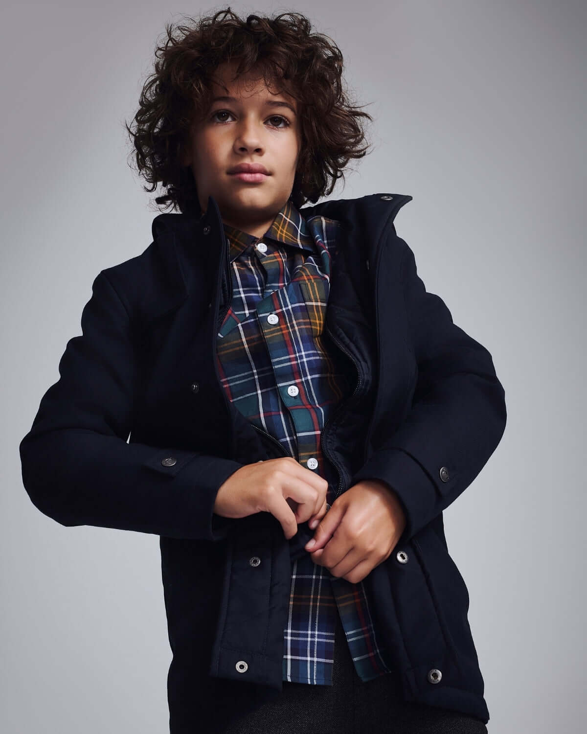 Navy Blue Urban Gotham Coat on a young boy, showcasing stylish design and premium fabric.