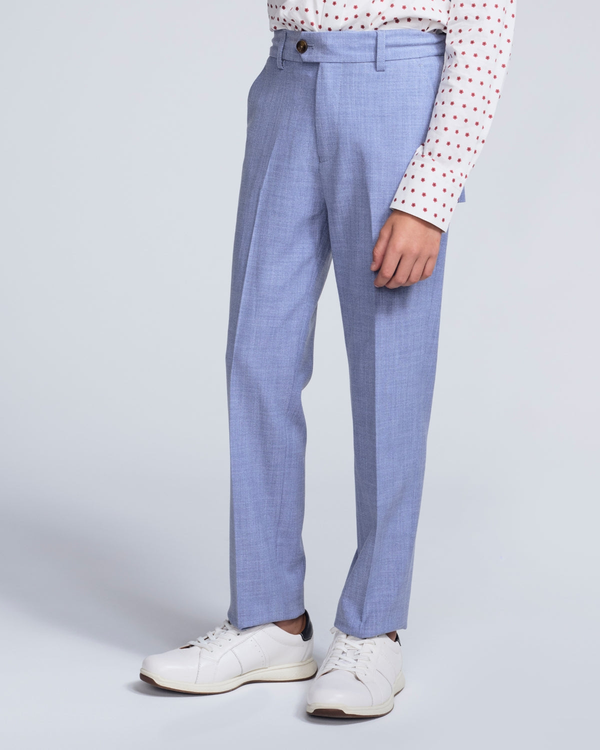 Light blue checkered pants worn by a person on a light gray background