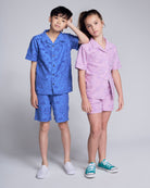Sunny Days Lilac Resort Shirt paired with matching shorts, showcasing summer style and cheerful prints.