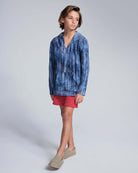 Boy wearing Waterfall Terry Baja Pullover with a tie dye pattern and matching shorts.
