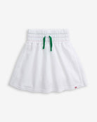 White Terry Laney Skort featuring a smocked waistband and green tie front detail.