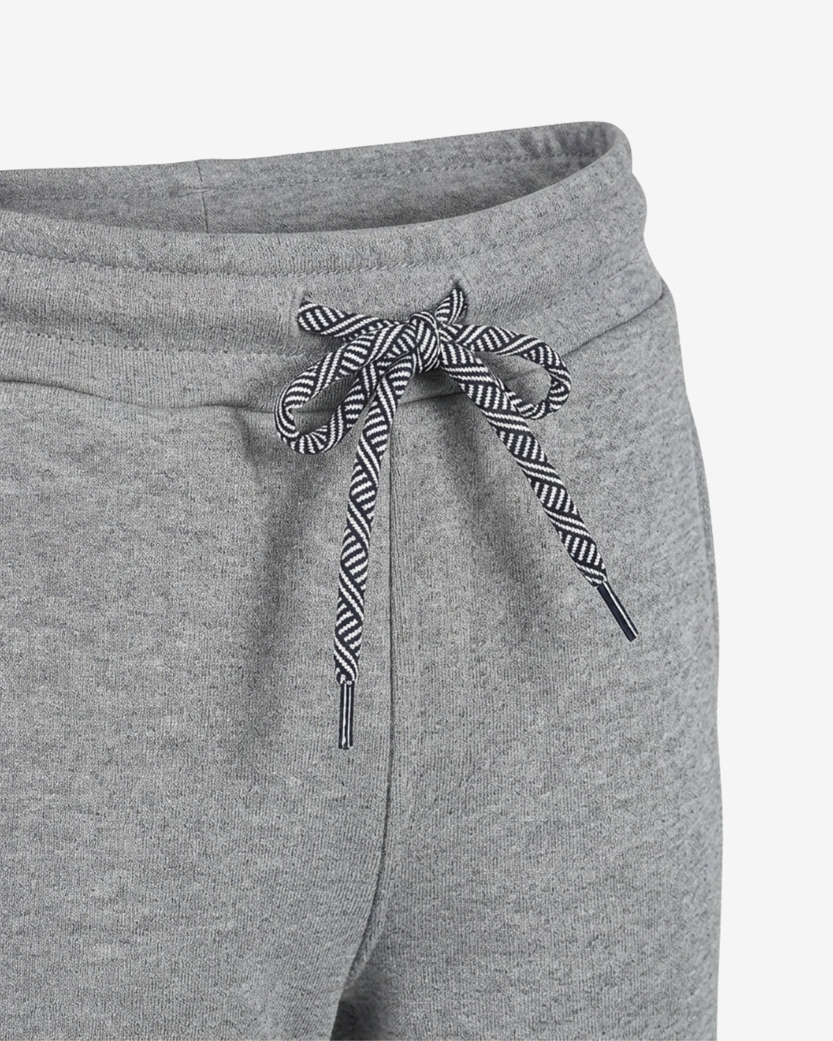 Close-up of gray heather sweatpants with a black and white striped drawstring tied in a bow at the waistband.