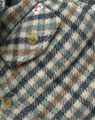 Beige Check Glen Flannel Hoodie close-up showing buttons and check pattern.