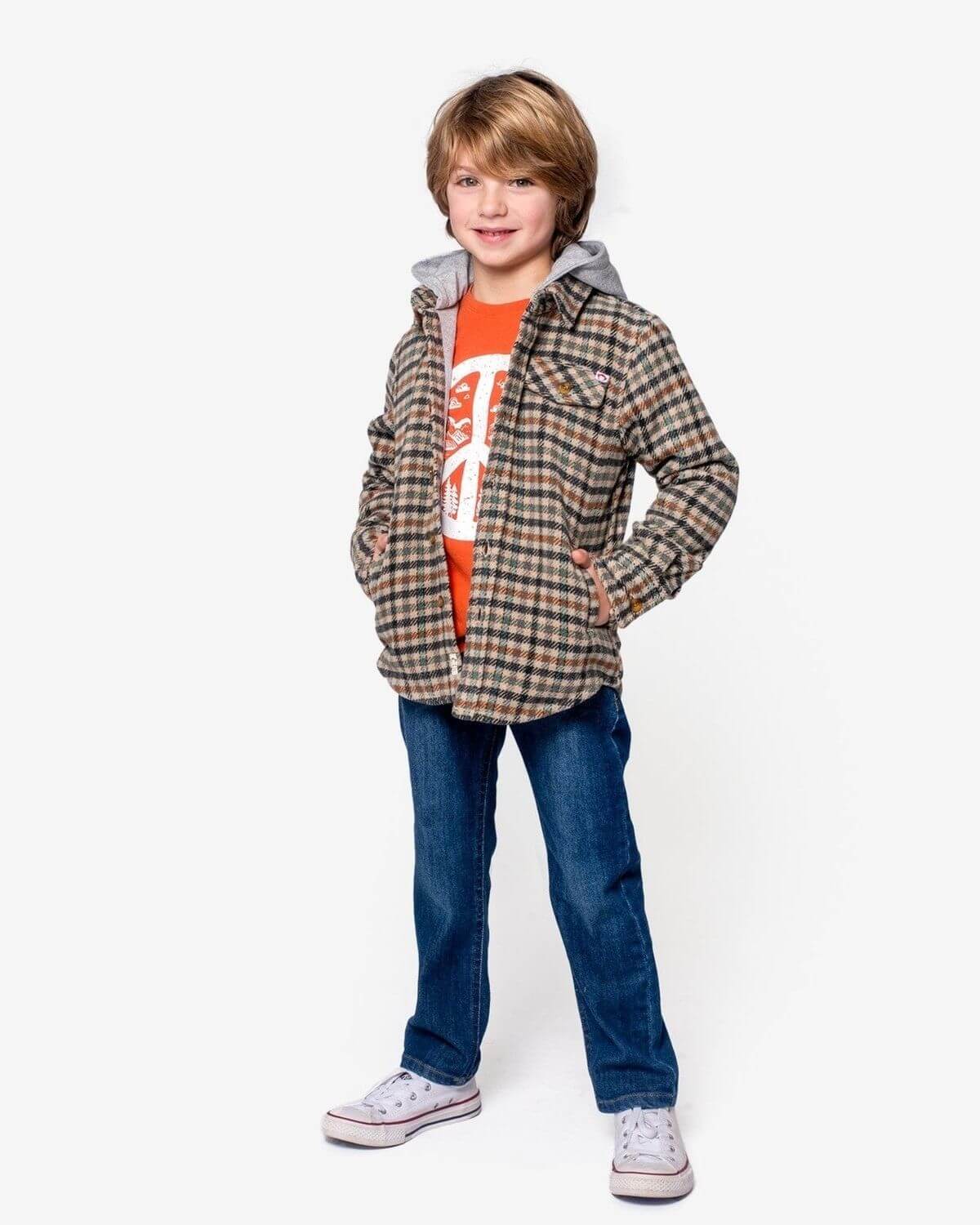 Boy wearing a Beige Check Glen Flannel Hoodie with front pockets, orange tee, and jeans.