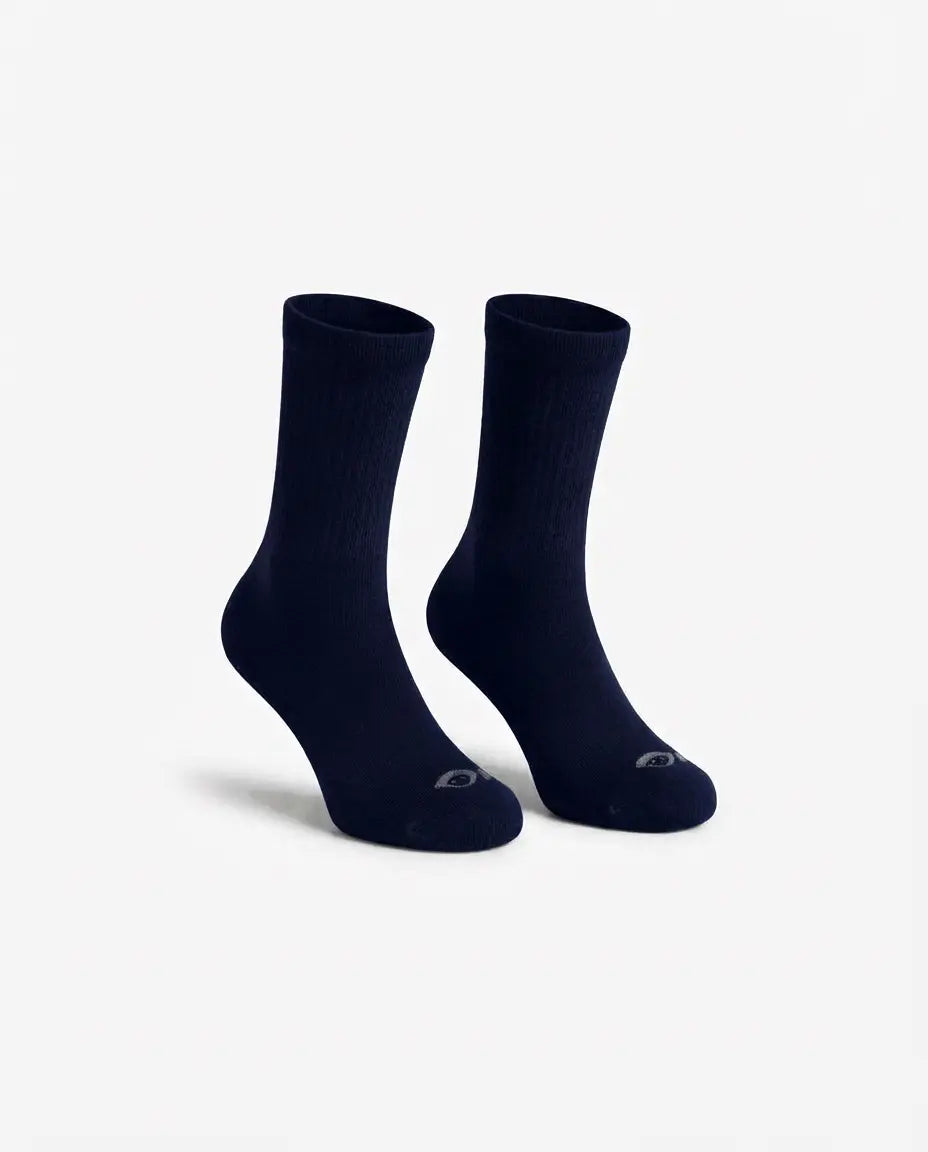 A pair of dark navy crew socks displayed on invisible forms against a clean, light gray background.
