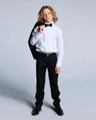 Tuxedo Suit Bundle 3-Piece Set featuring a young boy in a tuxedo jacket, dress shirt, bow tie, and tailored pants.