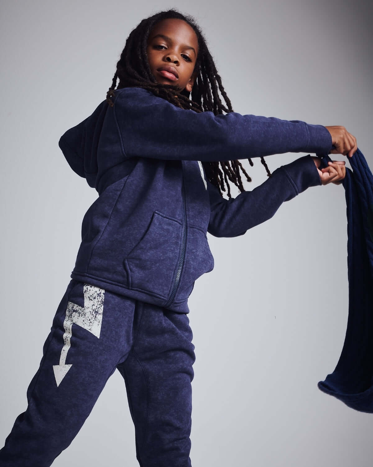Washed Navy Bolt Sidewalk Sweatpants on a kid, showcasing comfort and style with cargo pockets.