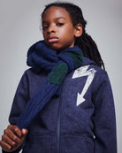 Washed Navy Bolt Strivers Hoodie worn by a kid with a scarf, showcasing street-style vibes.