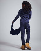 Child wearing the Washed Navy Bolt Strivers Hoodie, showcasing its cool style and cozy fit.