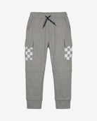 Cement Sweat Set boys' pants in gray with checkerboard pockets, perfect for active play and outdoor adventures.