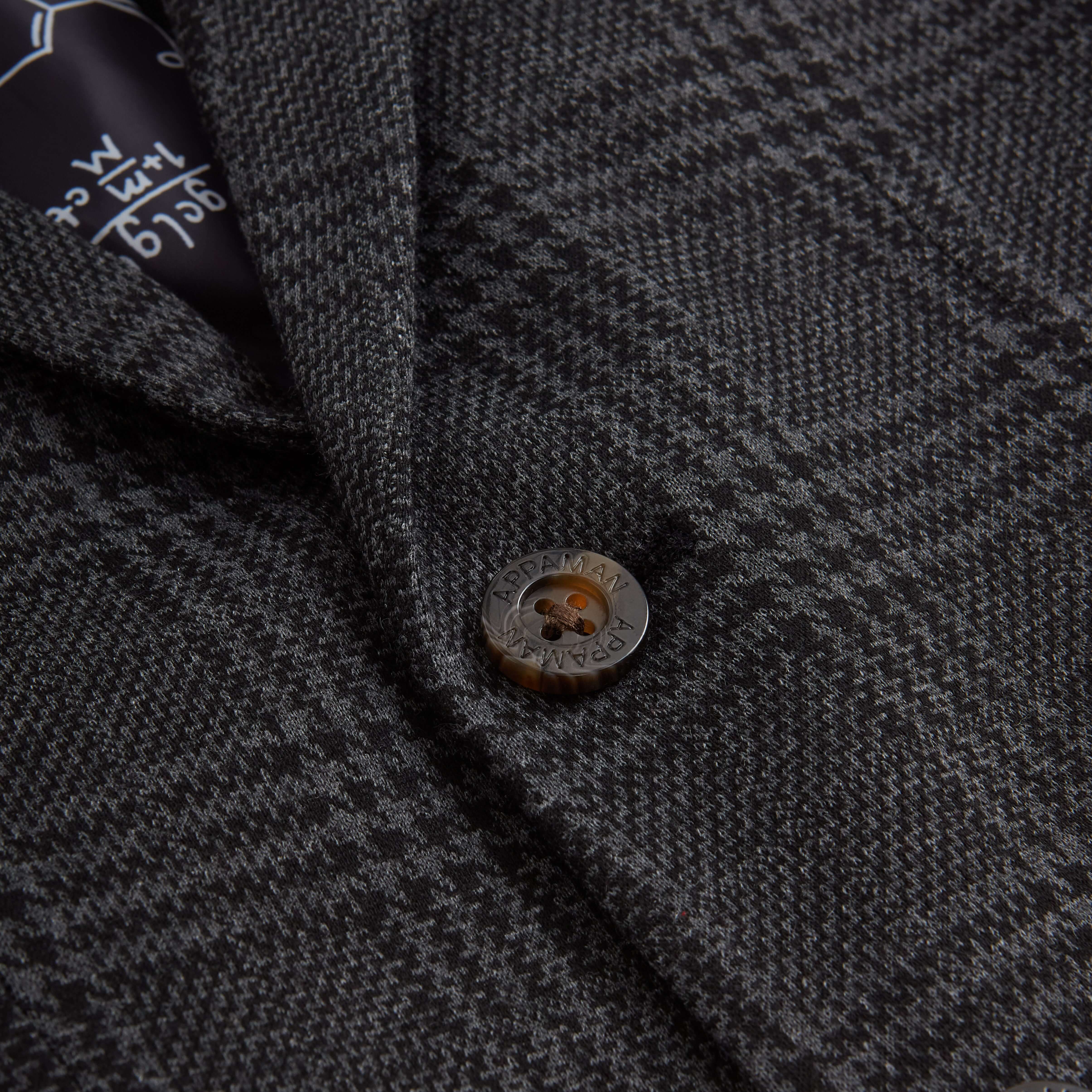 Close-up of the button detail on the Professor Plaid Club Jacket, showcasing its stylish plaid design.