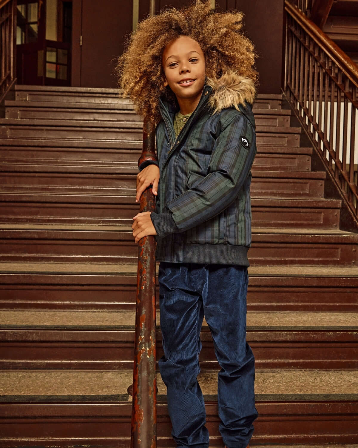 Navy Blue Club Pants worn with a stylish jacket, perfect for kids' outdoor adventures and casual outings.