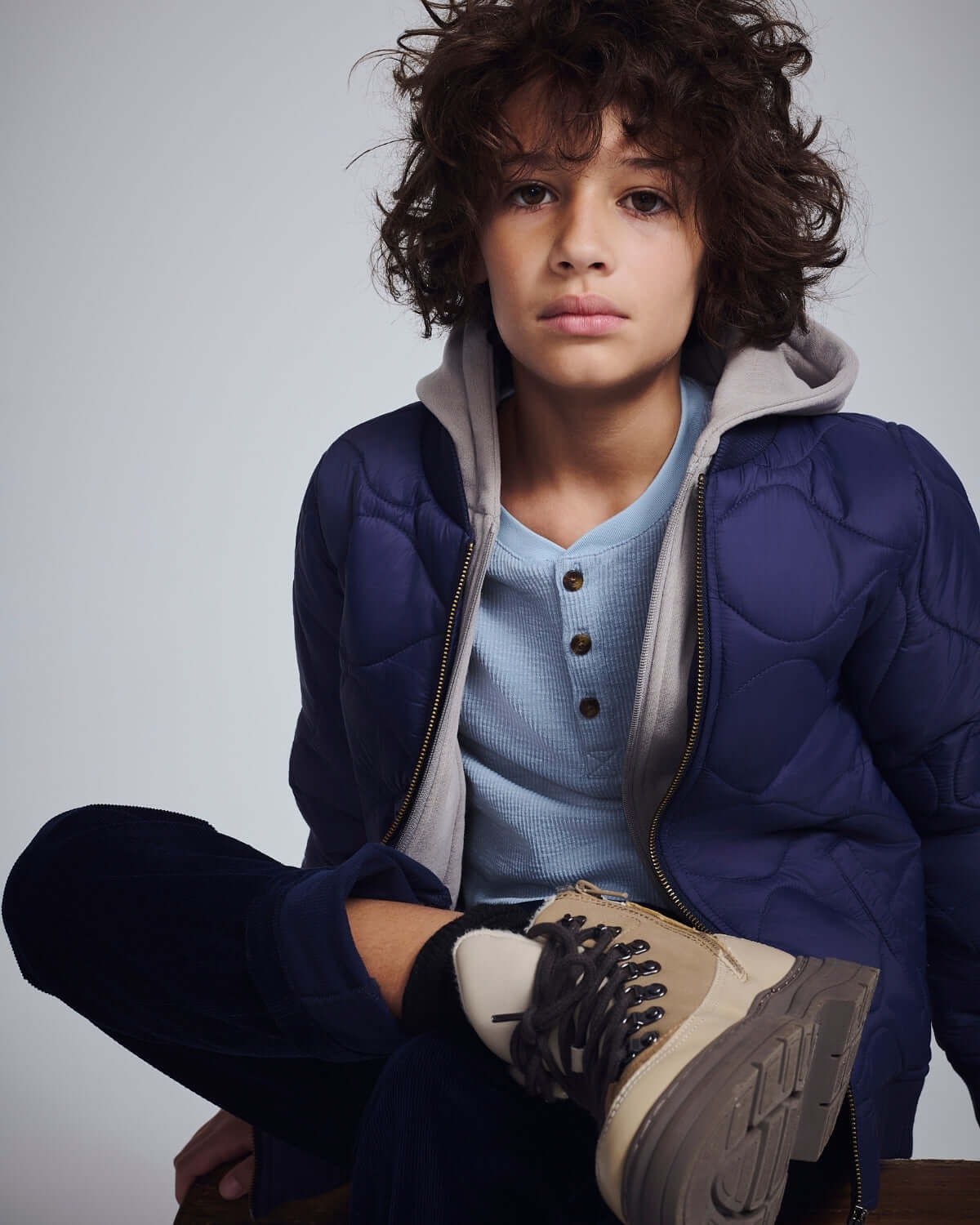 Child wearing Navy Blue Club Pants with a stylish jacket and sneakers, showcasing comfort and trendy design for everyday wear.