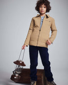Child wearing Navy Blue Club Pants with beige jacket holding a lantern, perfect for outdoor adventures.