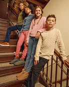 Kids wearing stylish outfits including Pewter Club Pants on a staircase.