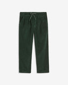 Spruce Club Pants featuring a green textured fabric, elastic waistband, and pockets for comfort and durability.