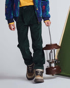 Child wearing Spruce Club Pants while holding a vintage lantern, showcasing comfort and adventure-ready style.