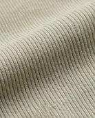 Close-up of the textured waffle knit fabric of the Cement Craftsman Thermal Henley for kids.