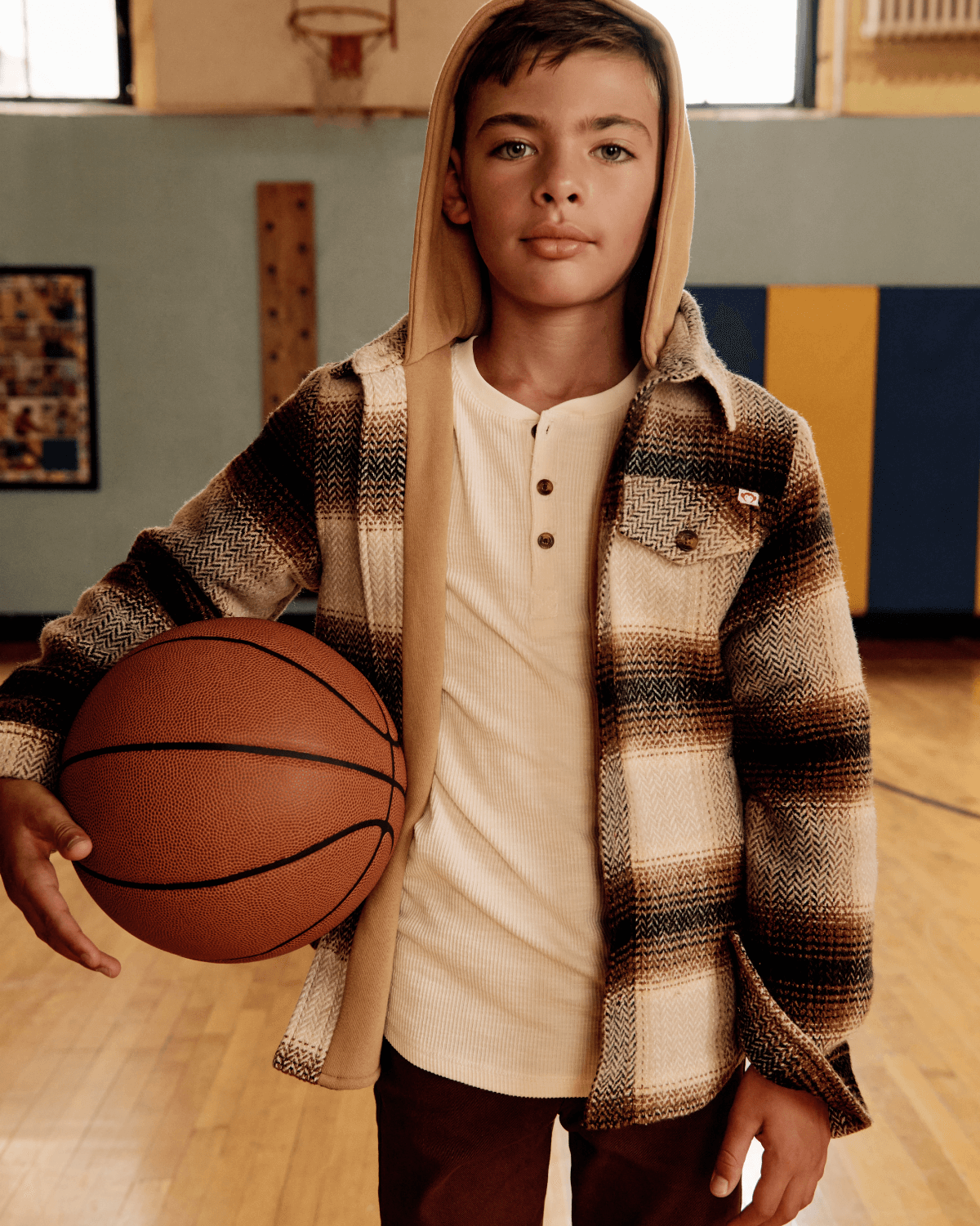 Winter White Craftsman Thermal Henley worn by a boy holding a basketball in a gym setting.