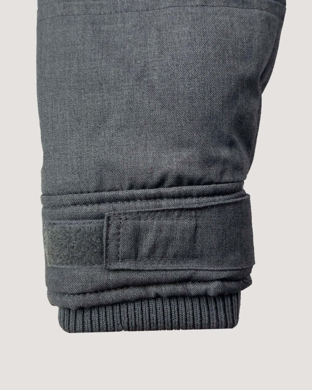 Close-up of the sleeve cuff on a Grey Denali Down Coat featuring ribbed and adjustable design.