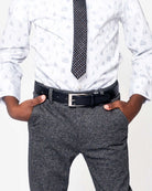 Boy wearing a stylish outfit with a Black Dress Belt and patterned tie, showcasing trendy fashion for kids.