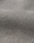 Close-up of the soft fabric used in Cement Empire Sweatpants, showcasing the neutral cement grey texture.