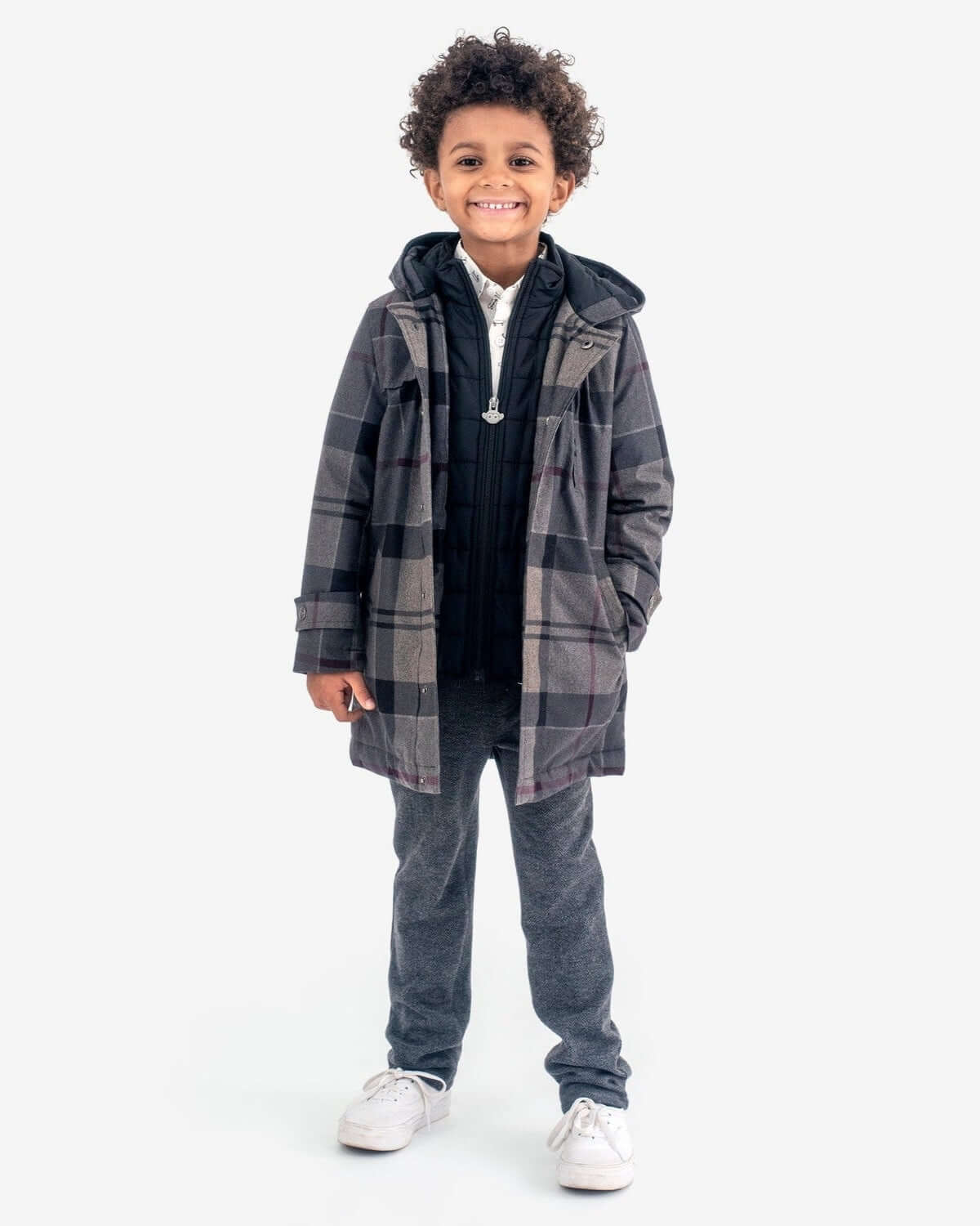 Charcoal Herringbone Everyday Stretch Pants worn by a smiling boy in a stylish layered outfit.