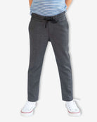 Dark Grey Everyday Stretch Pants worn by a child, featuring a drawstring and straight-leg design.