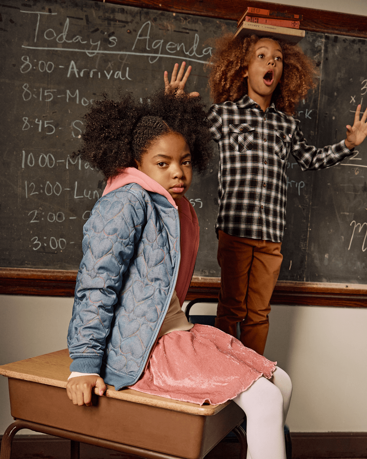 Kids in a classroom setting, one wearing a Black Umber Check Flannel Shirt, playful expressions with a chalkboard behind.