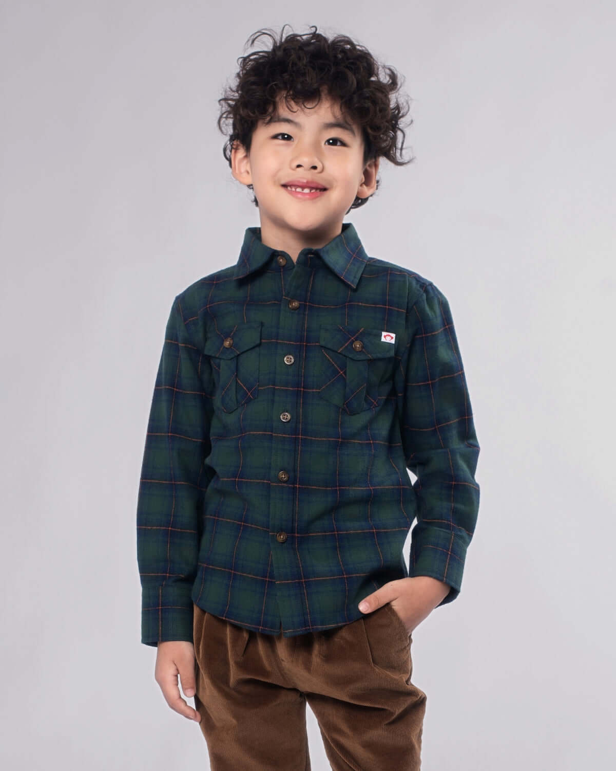 Blue/Green Plaid Flannel Shirt on a child, showcasing its button-down front and cozy design.