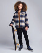 Blue Herringbone Plaid Glen Hooded Shirt worn by a stylish boy holding a skateboard, showcasing comfort and fashion.