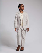 A boy wearing the Linen Grey Beach Pant with a matching Linen Grey Sports Jacket, stylish outfit for warm weather.