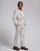 Linen Warm Grey Sports Jacket worn by a boy, showcasing timeless style and comfort in a formal setting.