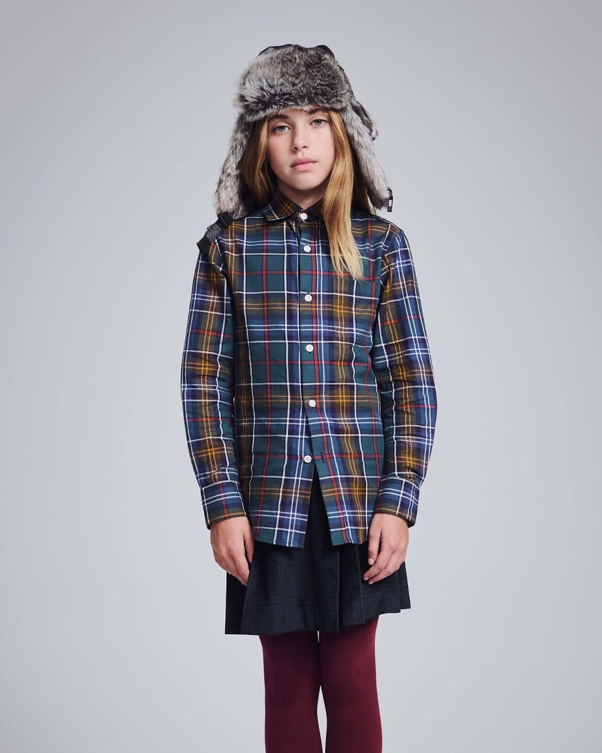 Light Grey Muscle Trapper with plaid design and faux fur lining, perfect for rugged style and cozy comfort.