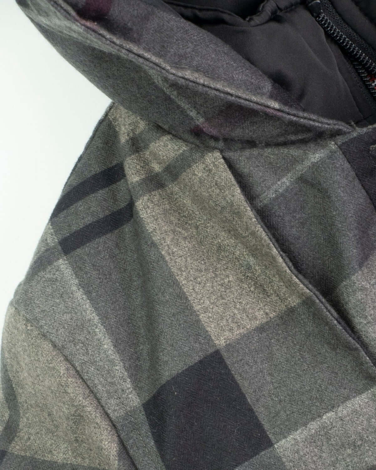 Close-up of the Grey Plaid New Gotham Coat showing its structured design and cozy hoodie.
