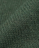 Close-up texture of the Hunter Green Obi Cardigan showing soft plush knit detail.