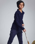 Boy wearing Navy Blue Parker Polo and playing with a hockey stick, showcasing active style and comfort.