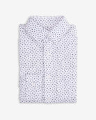 Paw Prints Standard Button Down shirt folded with playful dot design, perfect for kids' outfits.