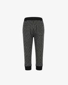 Black and gray houndstooth cropped pants with solid black ribbed waistband and cuffs, shown from the back on a light gray background.
