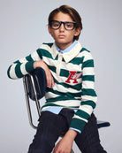 Boy wearing an Evergreen Stripe Rugby Shirt with a collar, showcasing bold green stripes and relaxed fit.