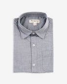 Grey Standard Button Down shirt folded neatly, showcasing its soft fabric and classic tailored design.