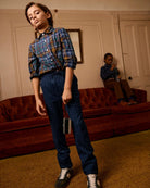 Lakeside Plaid Standard Button Down worn by a boy with denim pants, showcasing stylish comfort in a living room setting.
