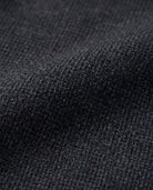 Close-up of Black Micro Houndstooth Stretchy Mod Suit fabric showcasing texture and detail.