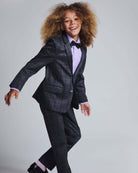 Child smiling in Gentleman's Plaid Stretchy Mod Suit, showcasing stylish design and comfortable fit.