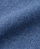 Close-up of Indigo Chambray Stretchy Mod Suit fabric showcasing its rich texture and comfortable stretch.
