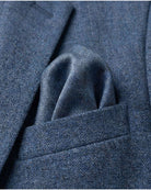 Indigo Chambray Stretchy Mod Suit with a stylish pocket square in a rich blue hue.