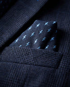 Shadow Prince of Wales Stretchy Mod Suit close-up showcasing pocket square with blue lightning pattern on dark navy fabric.