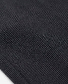 Close-up of the Black Micro Houndstooth Stretchy Mod Suit Pants fabric, showcasing its texture and quality for active boys.