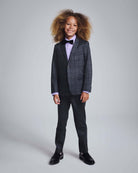 Gentleman's Plaid Stretchy Suit Pants modeled by a child in a stylish suit with a bow tie.