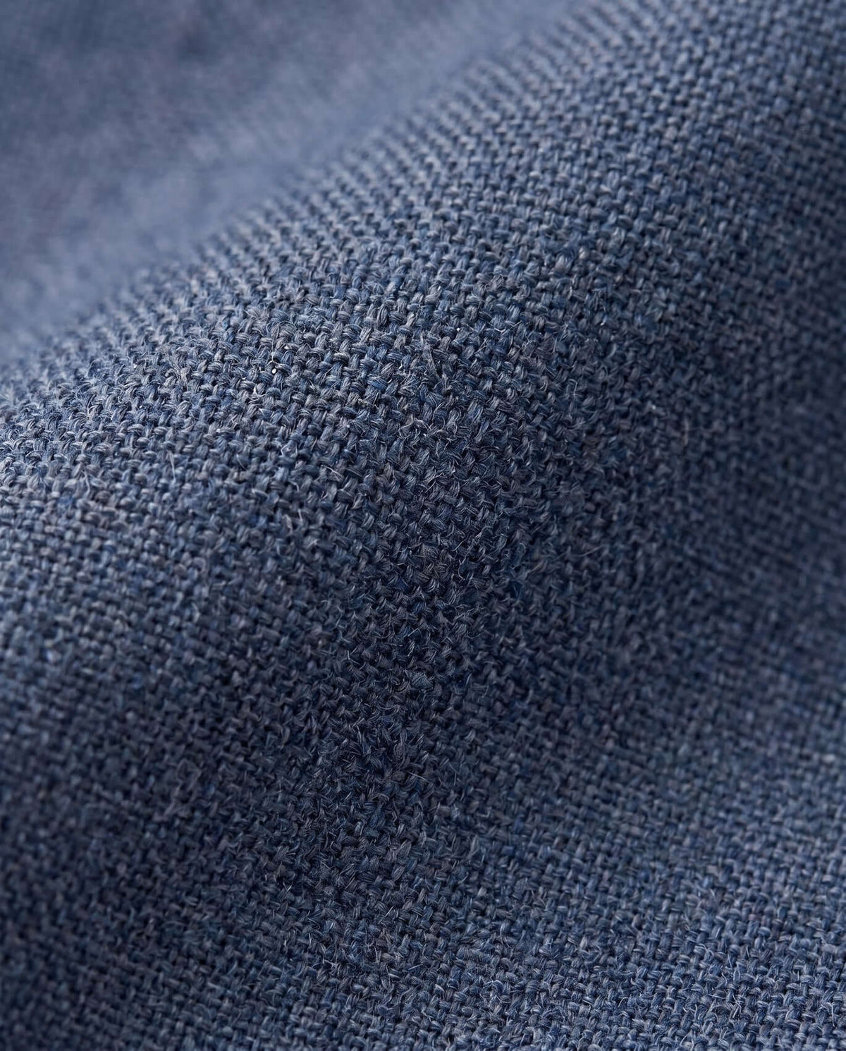 Texture of Indigo Chambray Stretchy Mod Suit Pants showcasing soft fabric and lightweight weave.